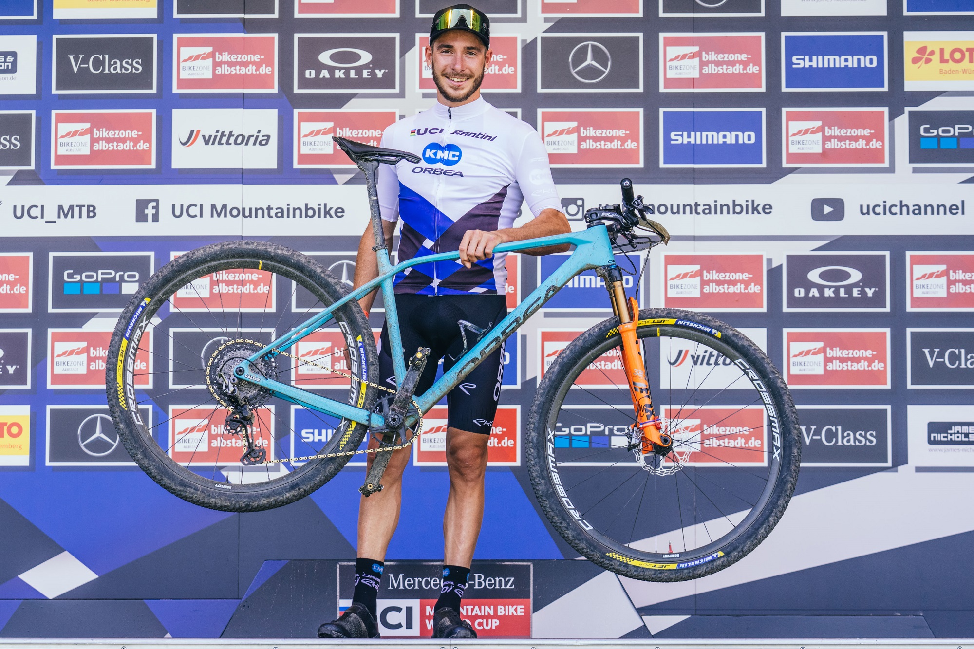 Victor Koretzky on the podium with his Orbea bike