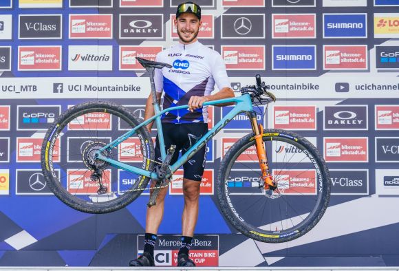 Victor Koretzky on the podium with his Orbea bike